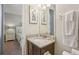 Small bathroom with vanity and view into bedroom at 471 Lasso Dr, Kissimmee, FL 34747
