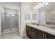 Double vanity bathroom with granite countertop and shower at 471 Lasso Dr, Kissimmee, FL 34747
