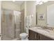 Bathroom with granite vanity, shower, and neutral tile at 471 Lasso Dr, Kissimmee, FL 34747