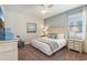Spacious bedroom with king-size bed, ceiling fan, and dresser at 471 Lasso Dr, Kissimmee, FL 34747