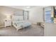 Spacious bedroom with king-size bed and light carpet at 471 Lasso Dr, Kissimmee, FL 34747