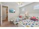 Bedroom with two twin beds, nightstands, and TV at 471 Lasso Dr, Kissimmee, FL 34747