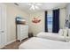 ' bedroom with twin beds, dresser, and wall art at 471 Lasso Dr, Kissimmee, FL 34747