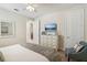 Bedroom with king-size bed, dresser, and access to bathroom at 471 Lasso Dr, Kissimmee, FL 34747