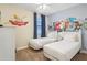 bedroom with twin beds and fun cartoon wall art at 471 Lasso Dr, Kissimmee, FL 34747