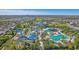Large community pool complex with water slides and a clubhouse at 471 Lasso Dr, Kissimmee, FL 34747