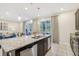 Kitchen with stainless steel appliances and granite countertop island at 471 Lasso Dr, Kissimmee, FL 34747