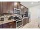 Modern kitchen with stainless steel appliances and granite countertops at 471 Lasso Dr, Kissimmee, FL 34747
