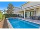 Large pool and spa with covered patio and seating at 471 Lasso Dr, Kissimmee, FL 34747