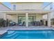Covered patio with pool access, seating, and dining area at 471 Lasso Dr, Kissimmee, FL 34747