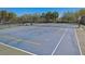 Tennis and pickleball court with surrounding fence at 471 Lasso Dr, Kissimmee, FL 34747