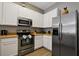Well-equipped kitchen with stainless steel appliances at 608 Rum Run # 608, Davenport, FL 33897