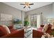 Spacious living room with two red couches and a balcony at 608 Rum Run # 608, Davenport, FL 33897
