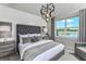 Spacious bedroom with lake view, plush bed, and elegant decor at 6376 Shimmering Shores Ln, Saint Cloud, FL 34771