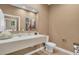 Modern bathroom with floating vanity and contemporary fixtures at 7598 Brooklyn Dr, Kissimmee, FL 34747
