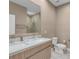 Modern bathroom with double vanity and walk-in shower at 7598 Brooklyn Dr, Kissimmee, FL 34747