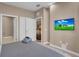 Spacious bedroom with a king-size bed and en-suite bathroom access at 7598 Brooklyn Dr, Kissimmee, FL 34747