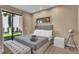 Bright bedroom with a king-size bed and access to a private patio at 7598 Brooklyn Dr, Kissimmee, FL 34747