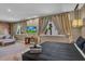 King bedroom with large window and sitting area at 7598 Brooklyn Dr, Kissimmee, FL 34747