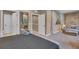 Spacious bedroom with king bed and access to bathroom and sitting area at 7598 Brooklyn Dr, Kissimmee, FL 34747