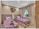 Bright bedroom with two twin beds and large window at 7598 Brooklyn Dr, Kissimmee, FL 34747