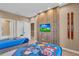 Charming bedroom with twin beds, a TV, and a wood accent wall at 7598 Brooklyn Dr, Kissimmee, FL 34747