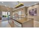 Modern kitchen with large island, stainless steel appliances, and ample counter space at 7598 Brooklyn Dr, Kissimmee, FL 34747