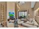 Spacious living room with sectional sofa, fireplace, and access to patio at 7598 Brooklyn Dr, Kissimmee, FL 34747