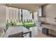 Outdoor kitchen with built-in grill and dining area at 7598 Brooklyn Dr, Kissimmee, FL 34747