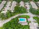 Arial view of community showing building rooftops, parking, and pool at 7707 Country Pl, Winter Park, FL 32792