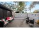 Deck with seating area and fenced backyard at 7707 Country Pl, Winter Park, FL 32792