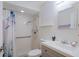 Clean bathroom with walk-in shower and grab bars at 7707 Country Pl, Winter Park, FL 32792