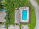 Arial view of community pool and surrounding landscaping at 7707 Country Pl, Winter Park, FL 32792