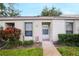 Neat and clean condo entrance with landscaping at 7707 Country Pl, Winter Park, FL 32792