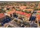 Aerial view showing the condo building's location and surrounding area at 903 Charo Pkwy # 836, Davenport, FL 33897