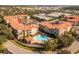 Aerial view of the community, highlighting the building and pool at 903 Charo Pkwy # 836, Davenport, FL 33897