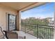 Private balcony with seating and treetop views at 903 Charo Pkwy # 836, Davenport, FL 33897