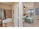 Bathroom with shower/tub combo, granite vanity, and tile flooring at 903 Charo Pkwy # 836, Davenport, FL 33897