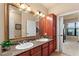 Double vanity bathroom with granite countertops at 903 Charo Pkwy # 836, Davenport, FL 33897