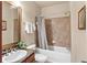 Clean bathroom with granite countertop and tub/shower at 903 Charo Pkwy # 836, Davenport, FL 33897