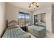 Bedroom with two twin beds and mirrored closet doors at 903 Charo Pkwy # 836, Davenport, FL 33897