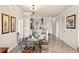 Charming dining area with a table and chairs, open to the kitchen at 903 Charo Pkwy # 836, Davenport, FL 33897