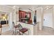 Kitchen with granite countertops, dark wood cabinets, and bar seating at 903 Charo Pkwy # 836, Davenport, FL 33897