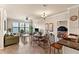 Living room features a sofa, dining table, and access to a bedroom at 903 Charo Pkwy # 836, Davenport, FL 33897