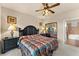 Spacious main bedroom with king-size bed and en-suite bathroom access at 903 Charo Pkwy # 836, Davenport, FL 33897
