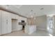 Open concept kitchen with white cabinets and an island at 1273 Jackson Hole Ct, Deland, FL 32724