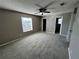 Comfortable bedroom with carpet flooring and a ceiling fan at 101 Zolfo Springs Ct, Kissimmee, FL 34743