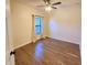 Bright bedroom with wood-look floors and window at 1720 Crocker Ave, Orlando, FL 32806