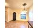 Elegant dining room with arched window and tiled floors at 1720 Crocker Ave, Orlando, FL 32806
