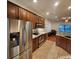 Kitchen with stainless steel appliances and wood cabinets at 1720 Crocker Ave, Orlando, FL 32806